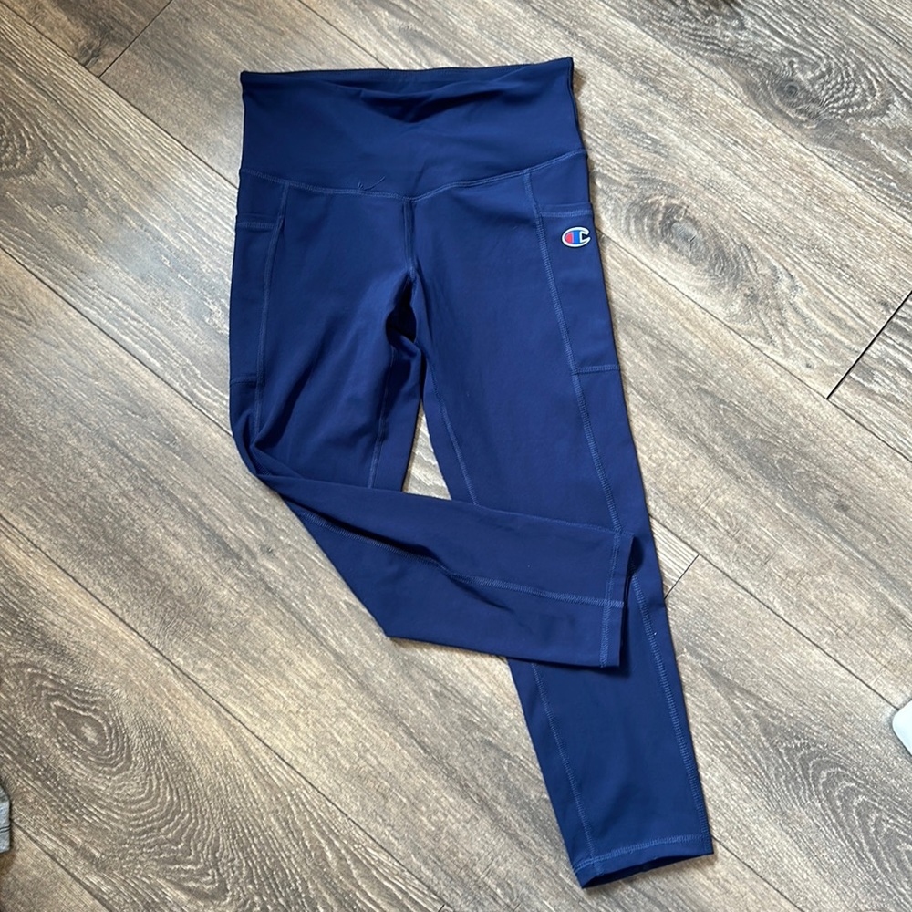 Champion navy leggings with side pockets, great for working out or hanging out.